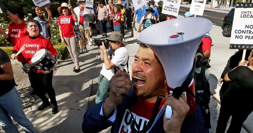 Los Angeles should raise pay for hotel and airport workers, report says