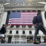 Dow hits record as Wall Street prepares for interest rate cuts