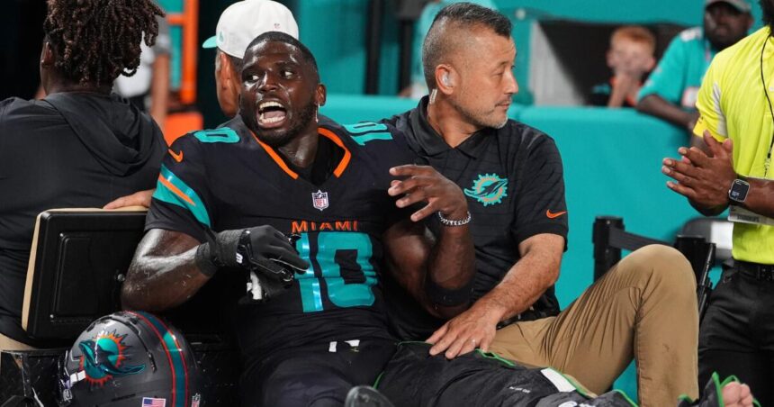 Dolphin's "Tyreek Hill" "laughing through pain" as he faces a season-ending knee injury