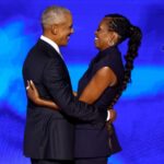 CHICAGO, ILLINOIS - AUGUST 20: Former U.S. President Barack Obama (L) greets former first lady Michelle Obama as he arrives to speak on stage during the second day of the Democratic National Convention at the United Center on August 20, 2024 in Chicago, Illinois. Delegates, politicians, and Democratic Party supporters are gathering in Chicago, as current Vice President Kamala Harris is named her party's presidential nominee. The DNC takes place from August 19-22. (Photo by Chip Somodevilla/Getty Images)