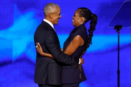 CHICAGO, ILLINOIS - AUGUST 20: Former U.S. President Barack Obama (L) greets former first lady Michelle Obama as he arrives to speak on stage during the second day of the Democratic National Convention at the United Center on August 20, 2024 in Chicago, Illinois. Delegates, politicians, and Democratic Party supporters are gathering in Chicago, as current Vice President Kamala Harris is named her party's presidential nominee. The DNC takes place from August 19-22. (Photo by Chip Somodevilla/Getty Images)