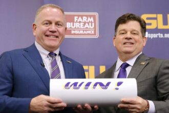 LSU's football coach and athletic director are absent. Still, the interim AD insists that ``this place is not broken.''