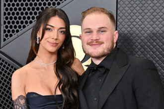 Brianna LaPaglia and Zach Bryan at the 2024 Grammys