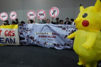 Demonstrators wearing Pikachu costumes demand Japan end fossil fuel financing at UN climate change conference
