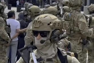 Department of Justice files suit to block California law regulating unidentified masked law enforcement officers