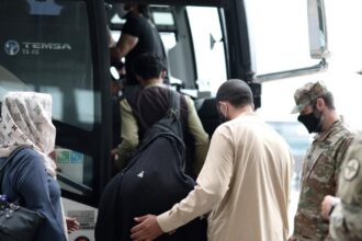 US tells Afghan migrants to report on Christmas and New Year's Day