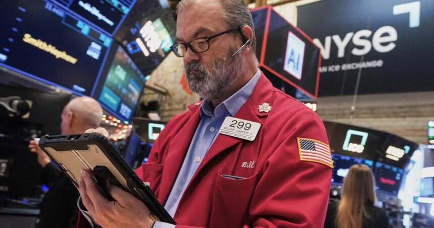 Stock market hits record high as concerns about AI bubble persist