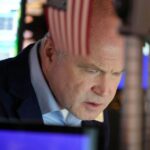 Stocks end slightly lower in quiet post-Christmas trading