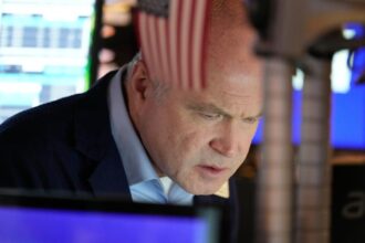 Stocks end slightly lower in quiet post-Christmas trading